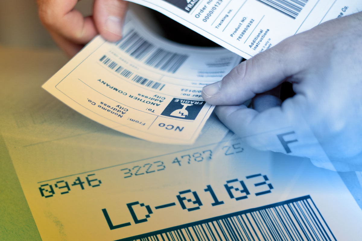 Functional or working labels - shipping label being applied to a box in top fading into the image of a barcode and human readable element below